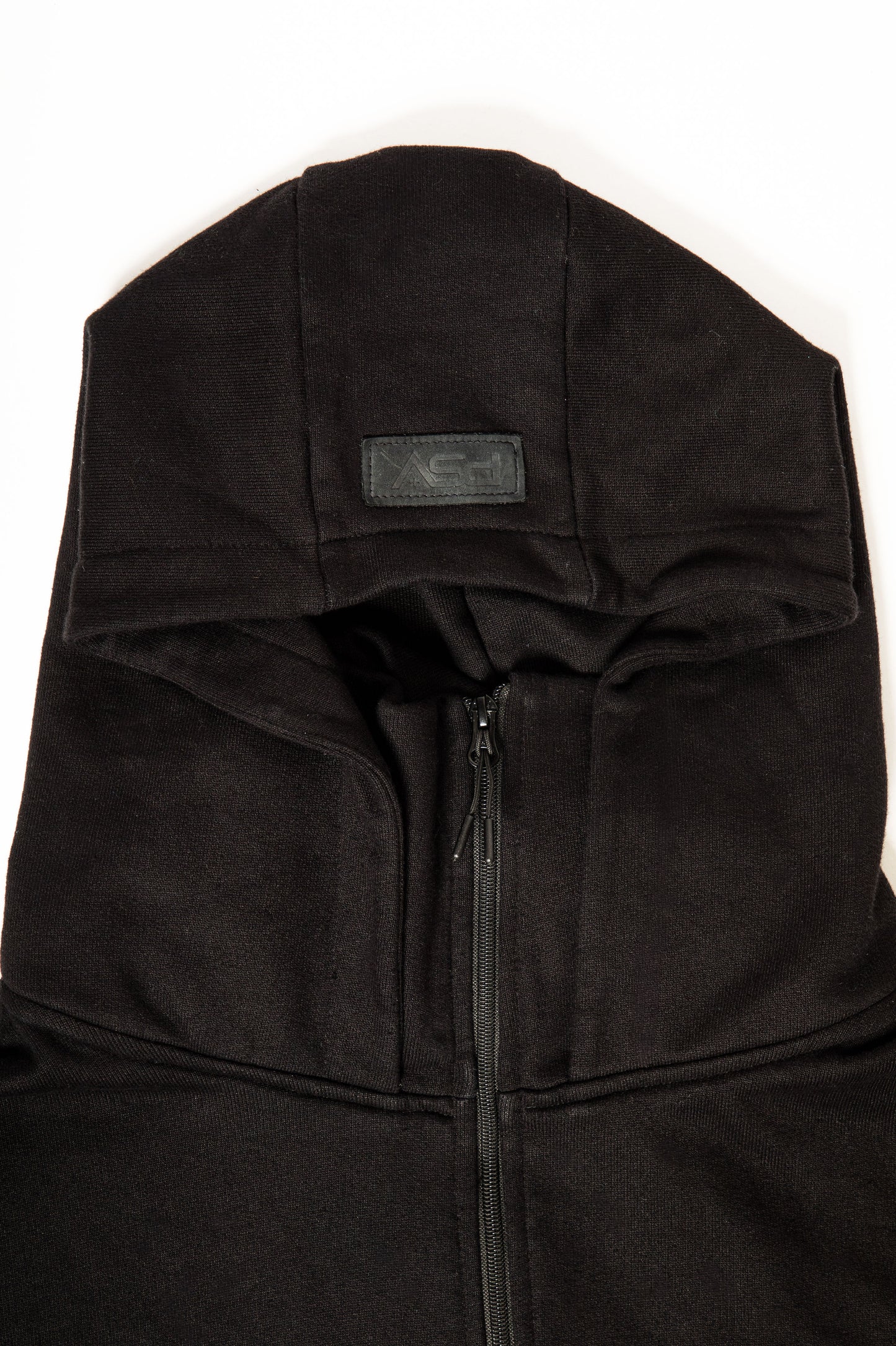 Black hoodie with a brand logo on a white background